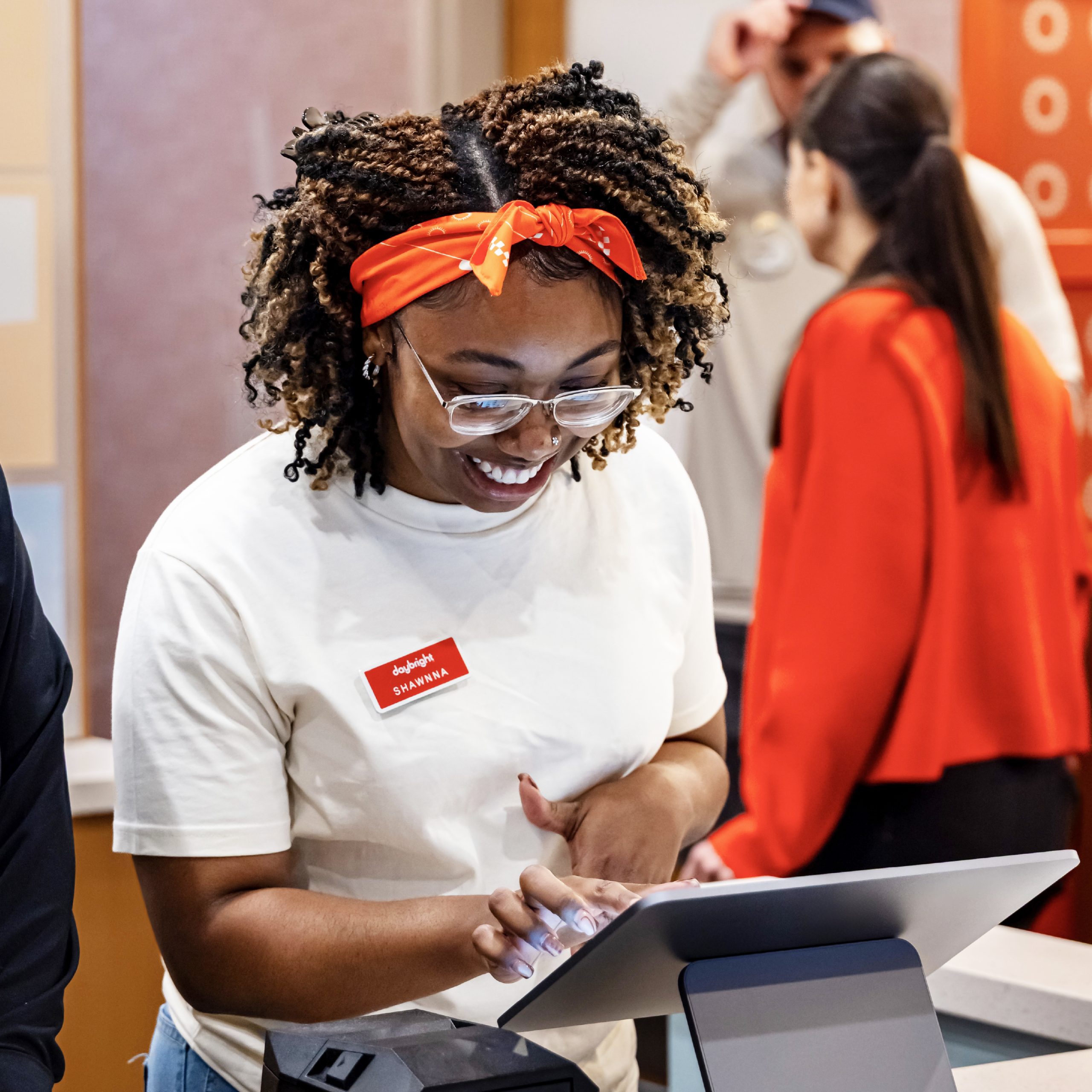 Smiling woman working at a cash register